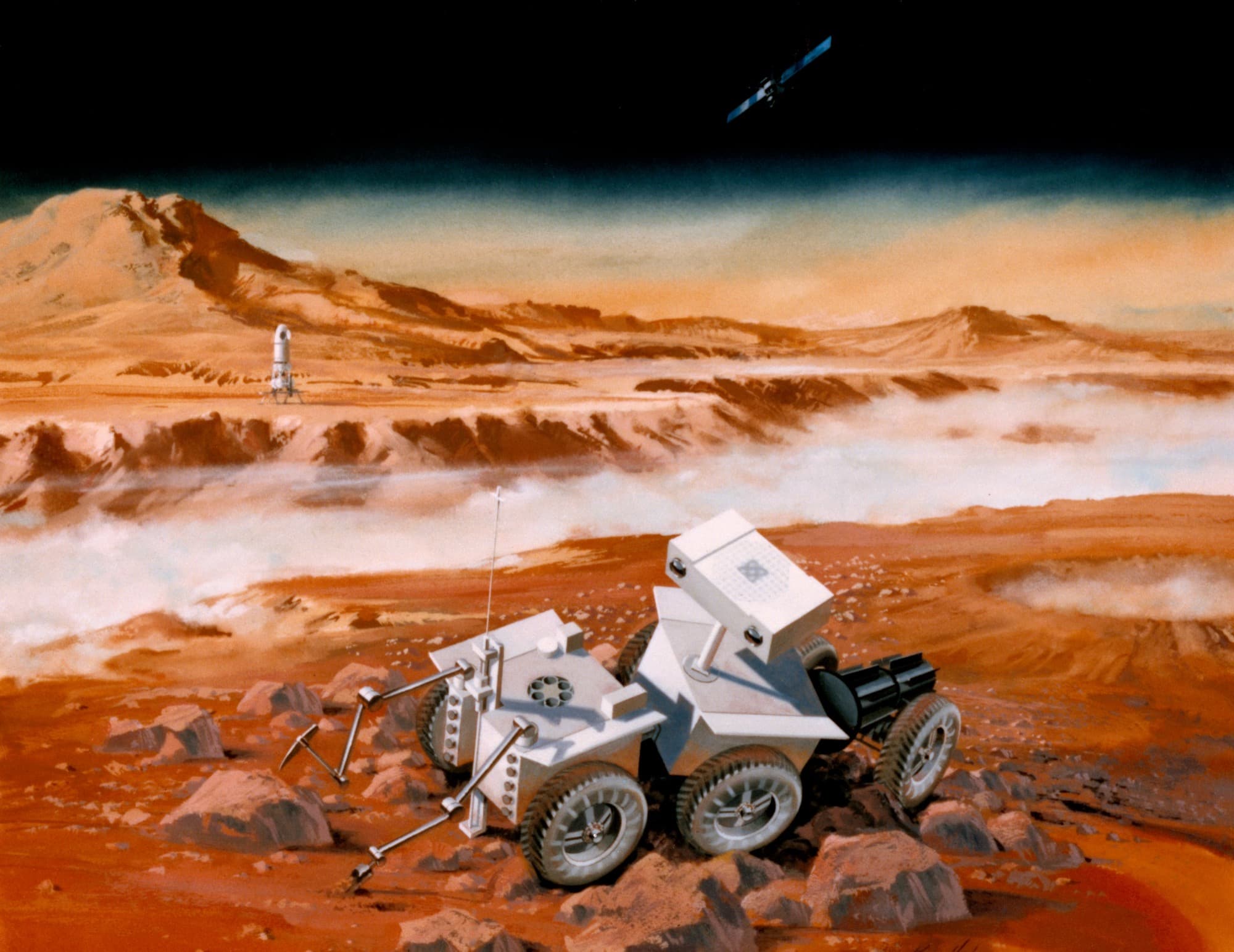 A NASA artist's painting, catalogued S87-35313 and dated 15 May 1987, of the Mars Sample Return mission then under joint study by the Jet Propulsion Laboratory and the Johnson Space Center. In the foreground a rover built as three linked two-wheeled cabs, carrying a stereo camera vision system and tool-equipped sampling arms, works among boulders; the lander with its ascent rocket stands on the plain in the middle distance and the orbiter crosses the black sky at upper right. NASA's own caption describes a rover that would spend a year collecting rock and soil, drive back to the lander and hand its samples to a small rocket for rendezvous in Mars orbit.