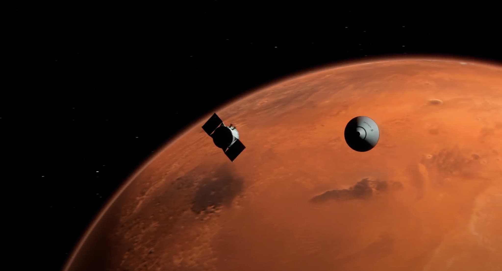 An Impulse Space render of the Mars Cruise Vehicle, a small spacecraft with two black solar panels, flying beside the released entry capsule and its blunt heat shield above a mostly sunlit Mars, with the night side falling away at the left limb.