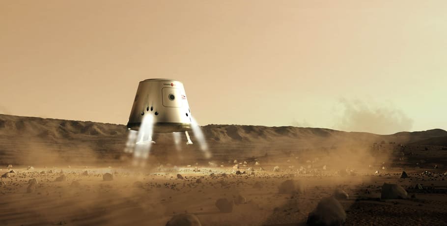 A digital render of a white conical capsule carrying a small Mars One roundel, hanging above a rocky red plain on its descent engines with its landing legs out and a dust cloud rolling away downrange; on the Mars One roadmap page this illustrated the 2016 supply mission, which the accompanying text said would launch in January 2016 and land that October with 2,500 kilograms of spares, solar panels and supplies.