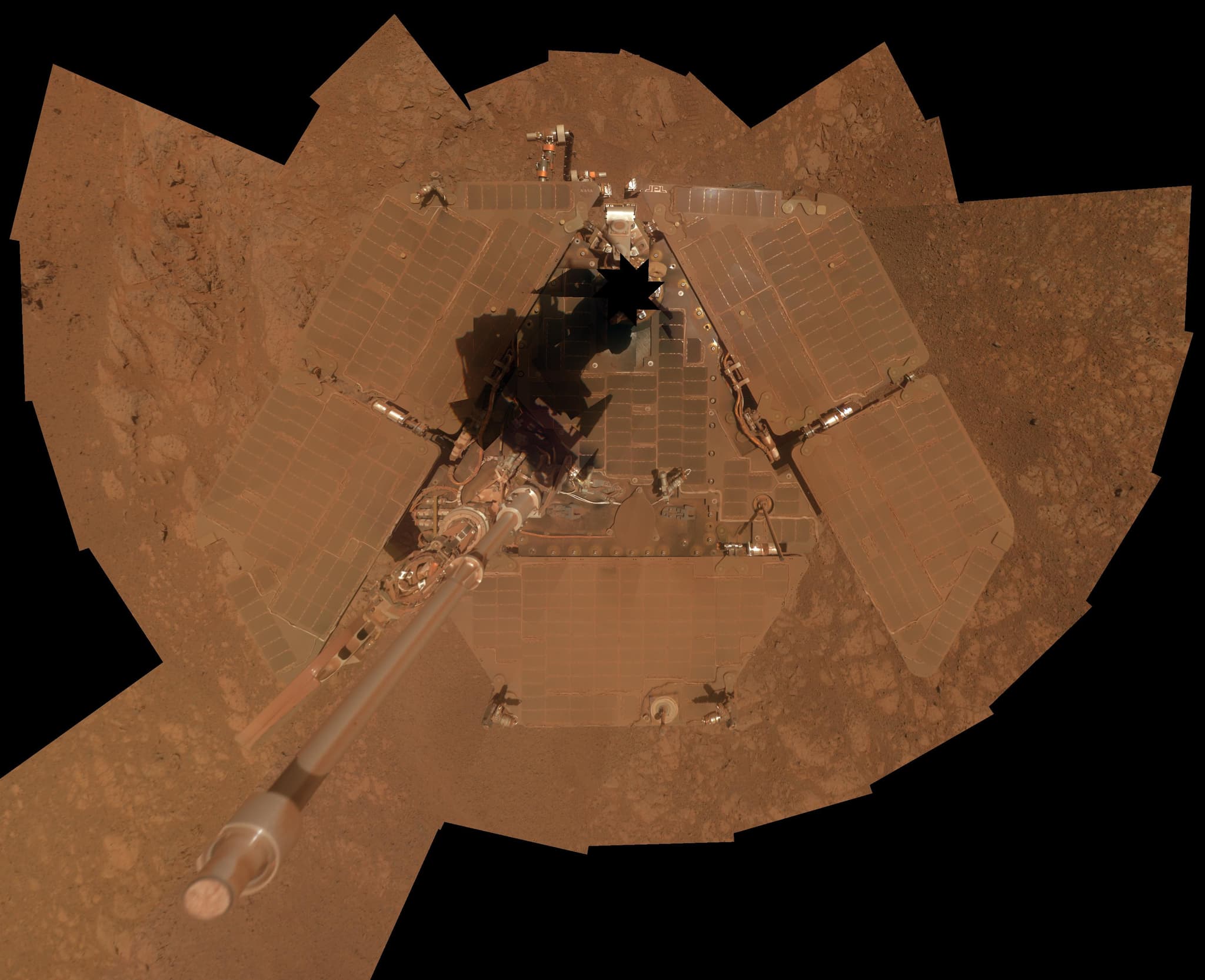 PIA17759, a vertical-projection Pancam self-portrait assembled from frames taken 3 to 6 January 2014, about three weeks before Opportunity completed ten years on Mars, with dust still coating the solar arrays after a partial wind cleaning.