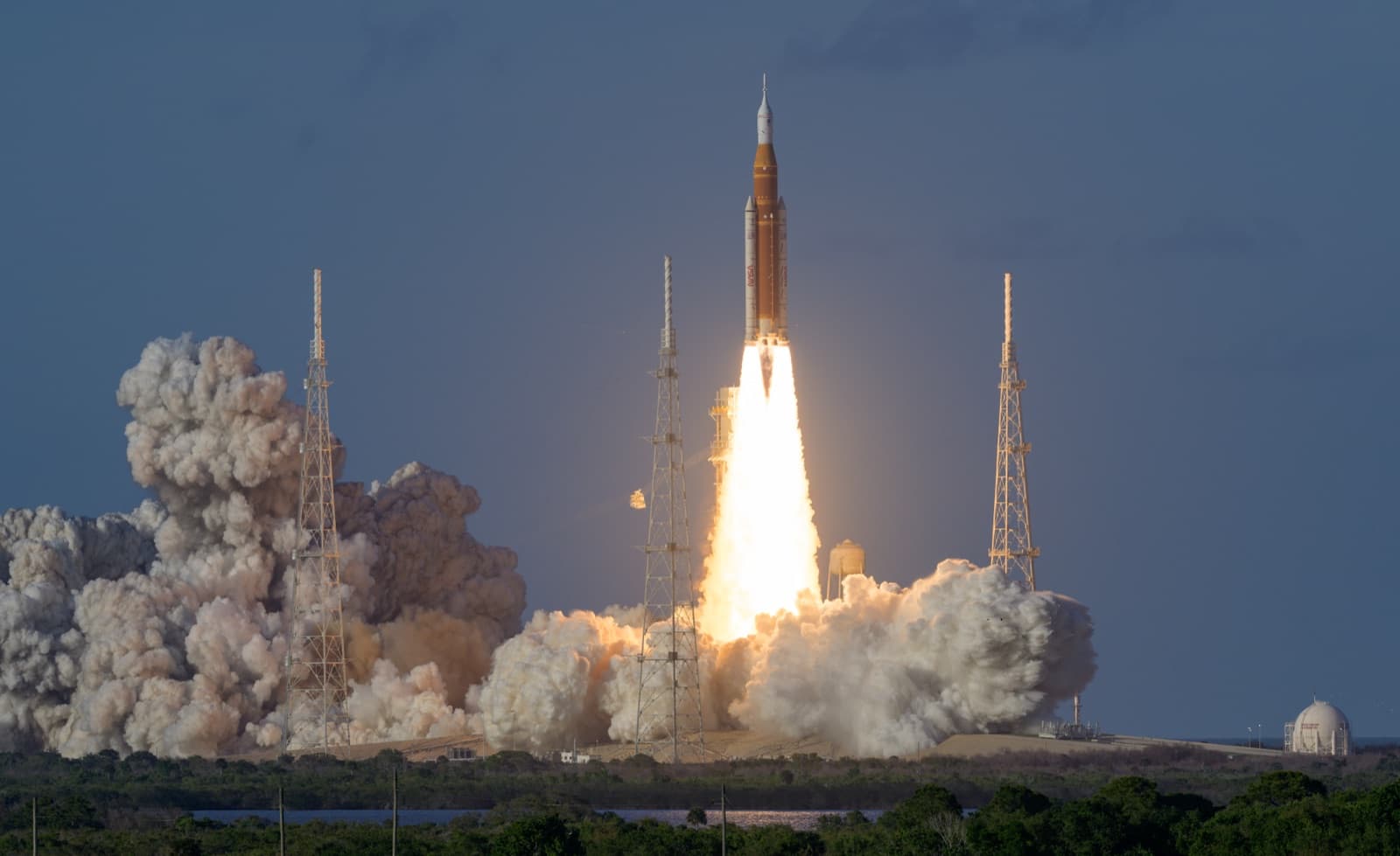 The SLS rocket lifting off from Launch Complex 39B carrying the Artemis II crew