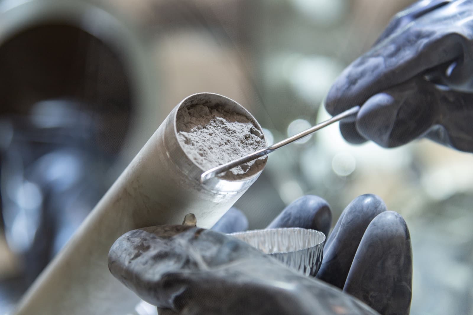 Photograph: curators ease Apollo 17 core sample 73001 out of its drive tube at Johnson Space Center in March 2022, the first time it had left the tube since it was collected and sealed under vacuum on the Moon in December 1972
