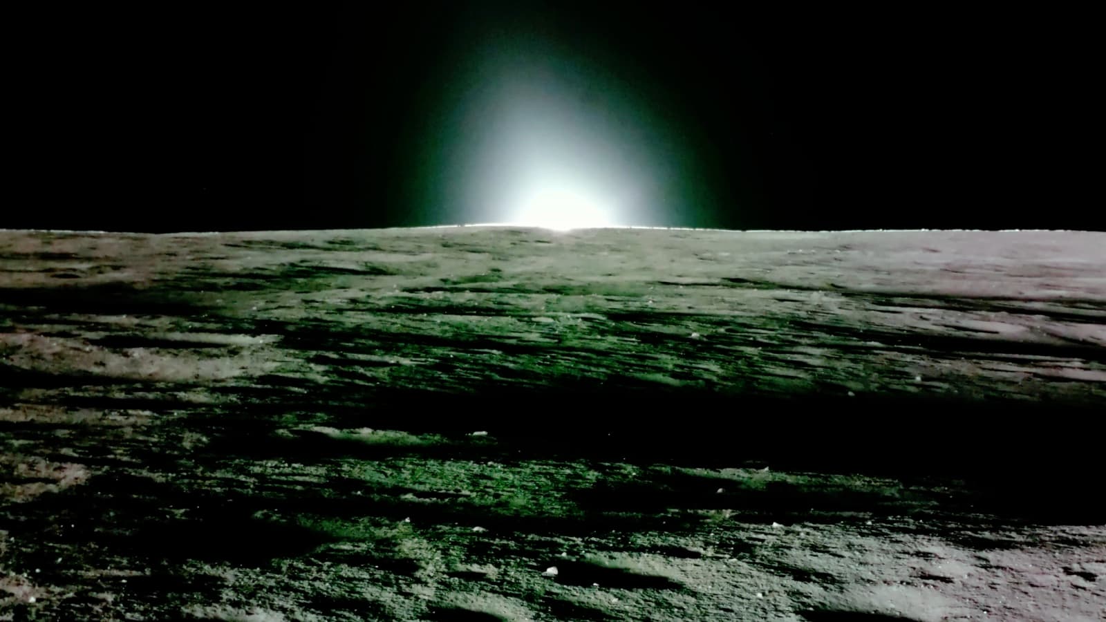Photograph (colours as released): the Sun setting over Mare Crisium, seen from the surface by Firefly's Blue Ghost 1 lander in March 2025