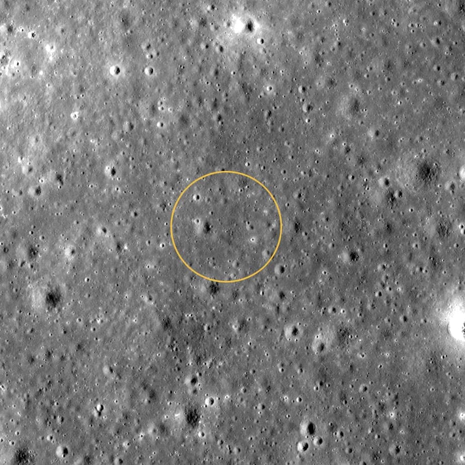 LRO Narrow Angle Camera view of grey ground pocked with small craters in 2018, with a yellow circle at the centre marking where the new crater would form